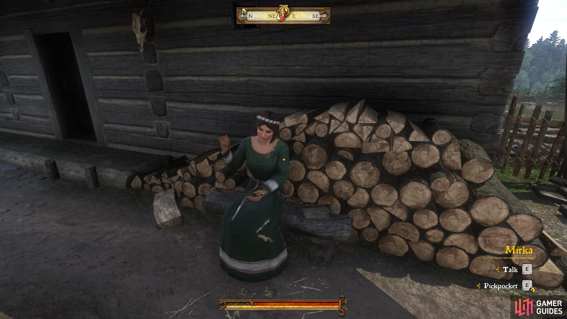 Mirka can usually be found outside the lodge in front of the log store.