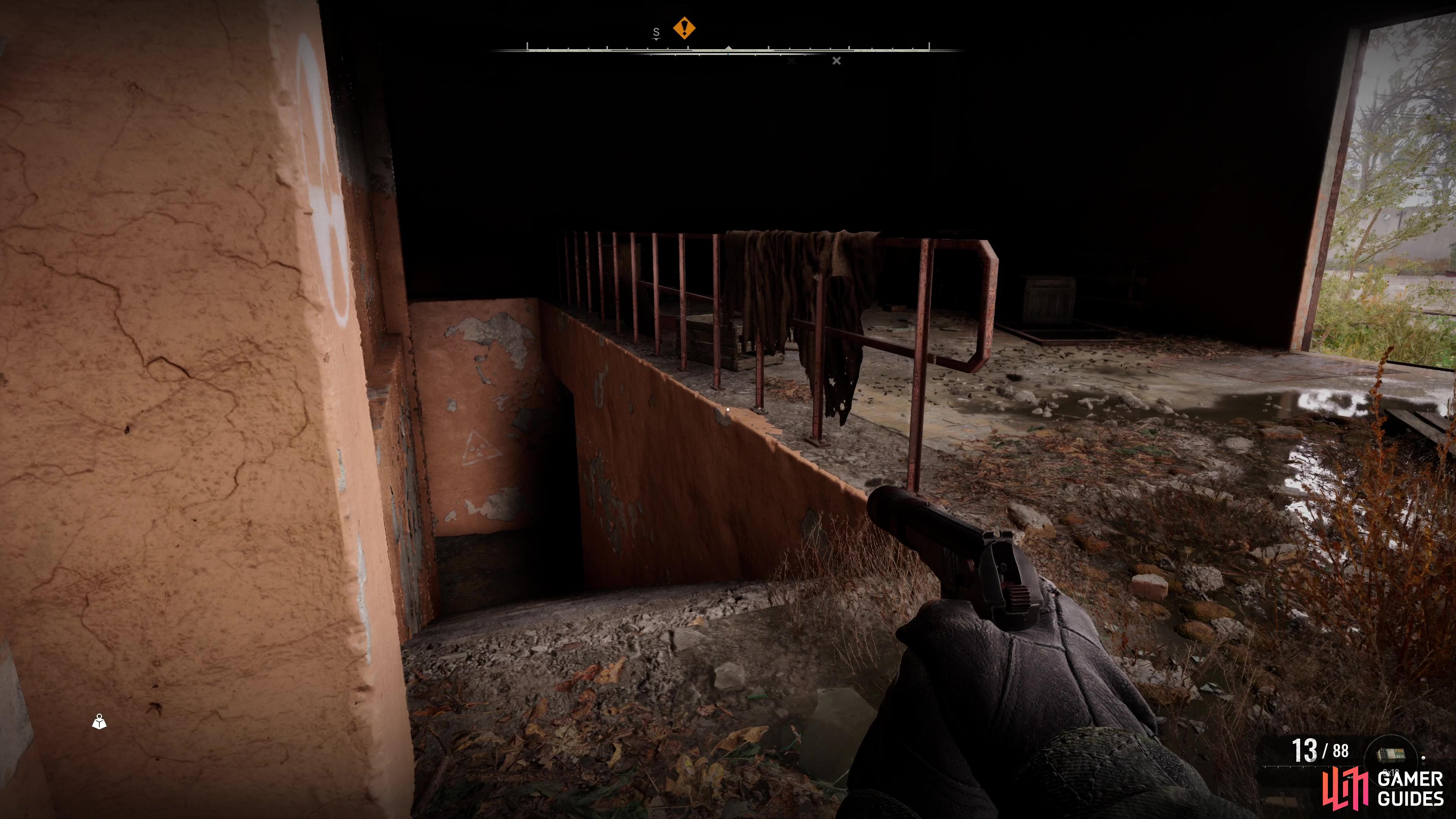 Once you’re ready, take the stairs down here to reach the locked door leading to the lab.