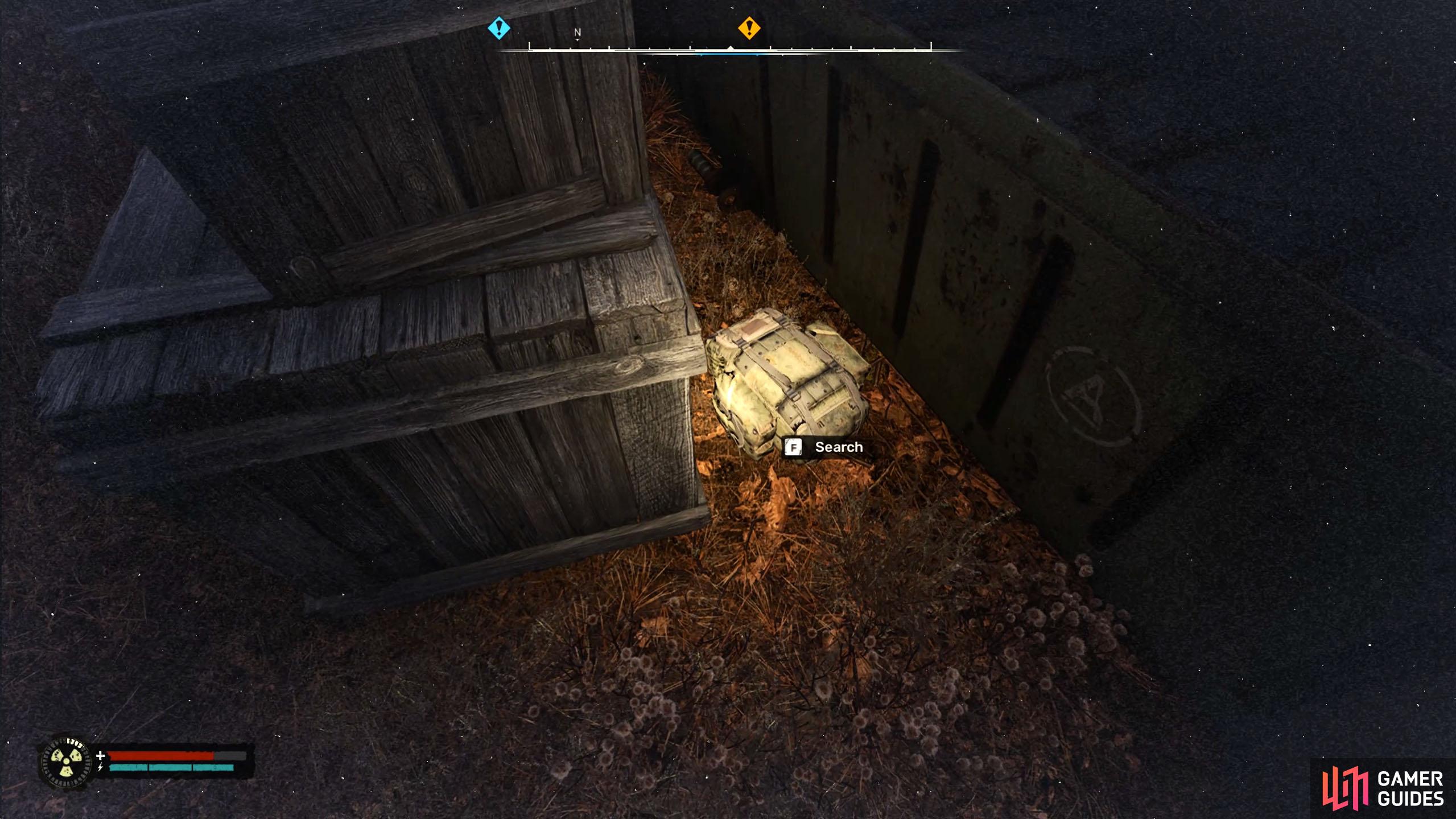 The Inductor will be in the backpack behind the crates.