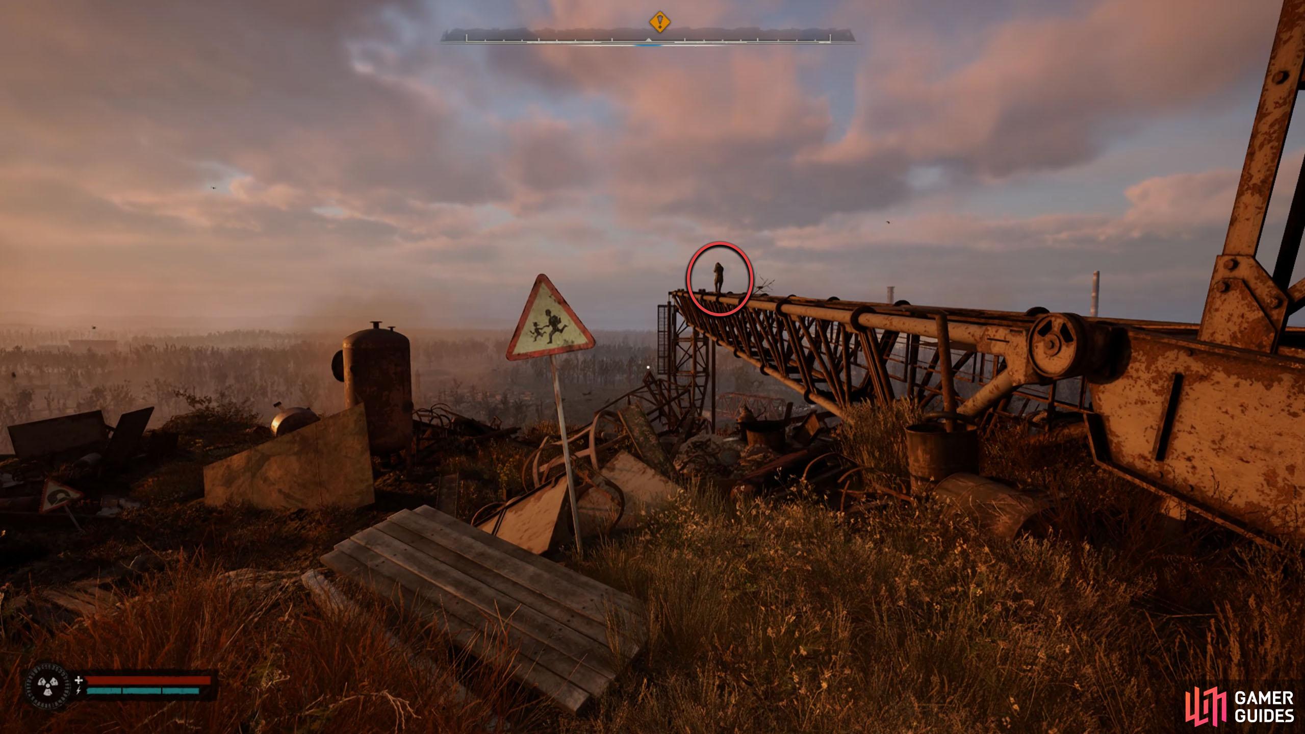 Climb the ladder and head over to the person on the crane for a scene.