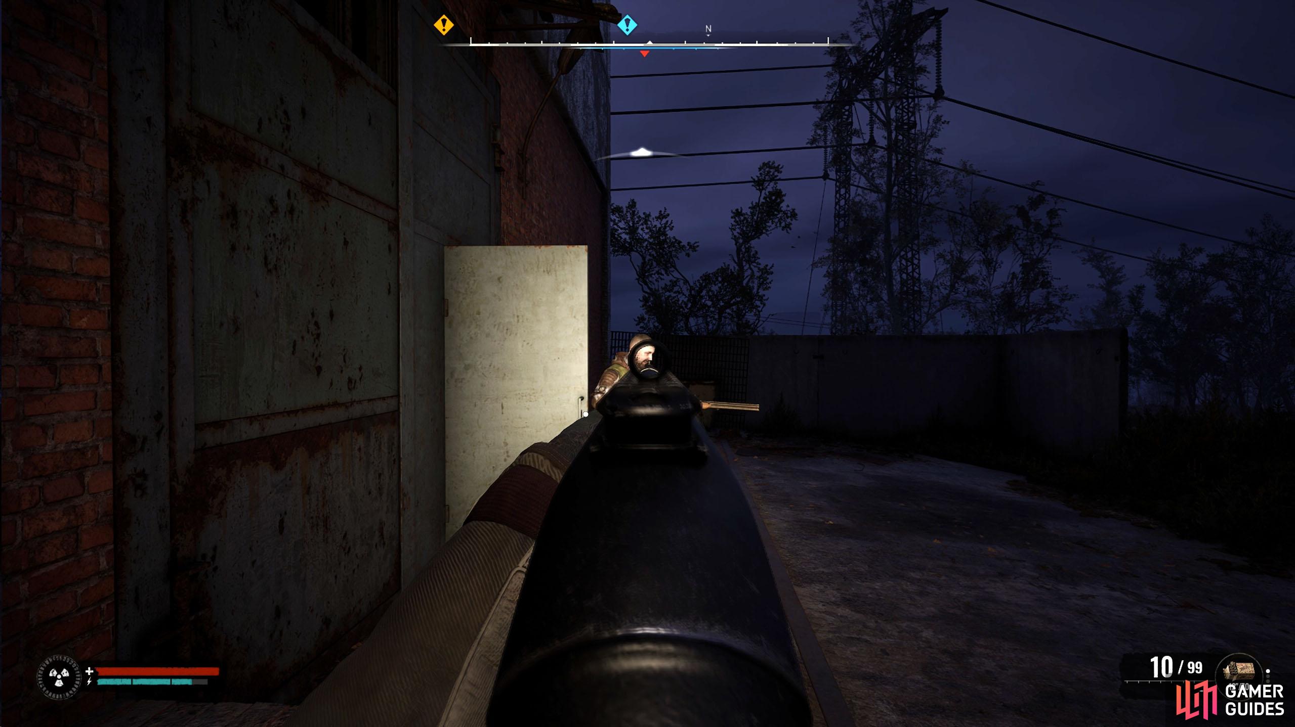 As you reach the main building, a zombie will come out of the door.