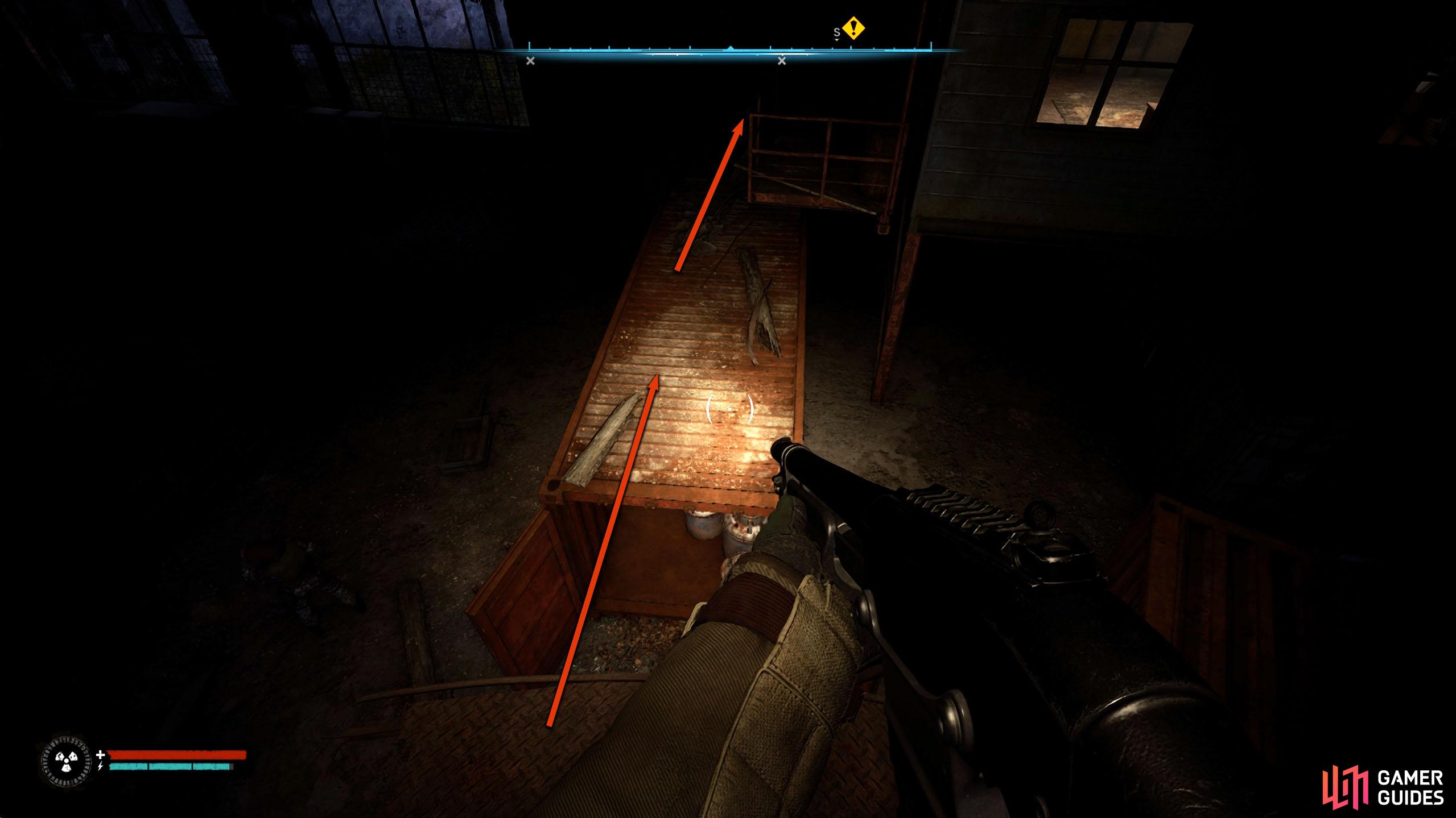 Use the containers below the walkway to get across to the other side.