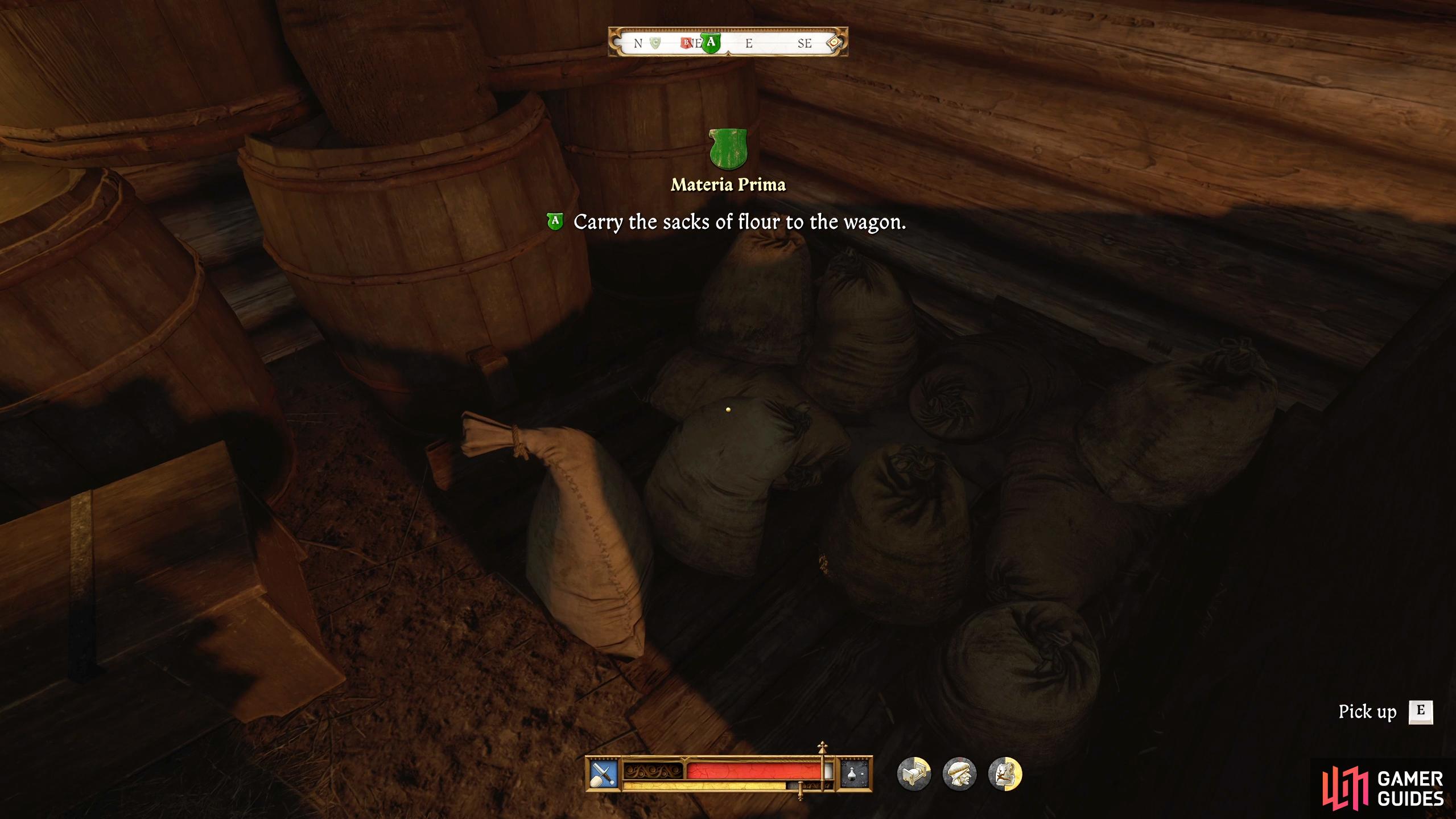 The sacks of flour are in the building to the right of the wagon.