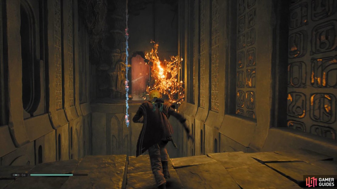 Throw the lantern at the branches to free the button and interact with it