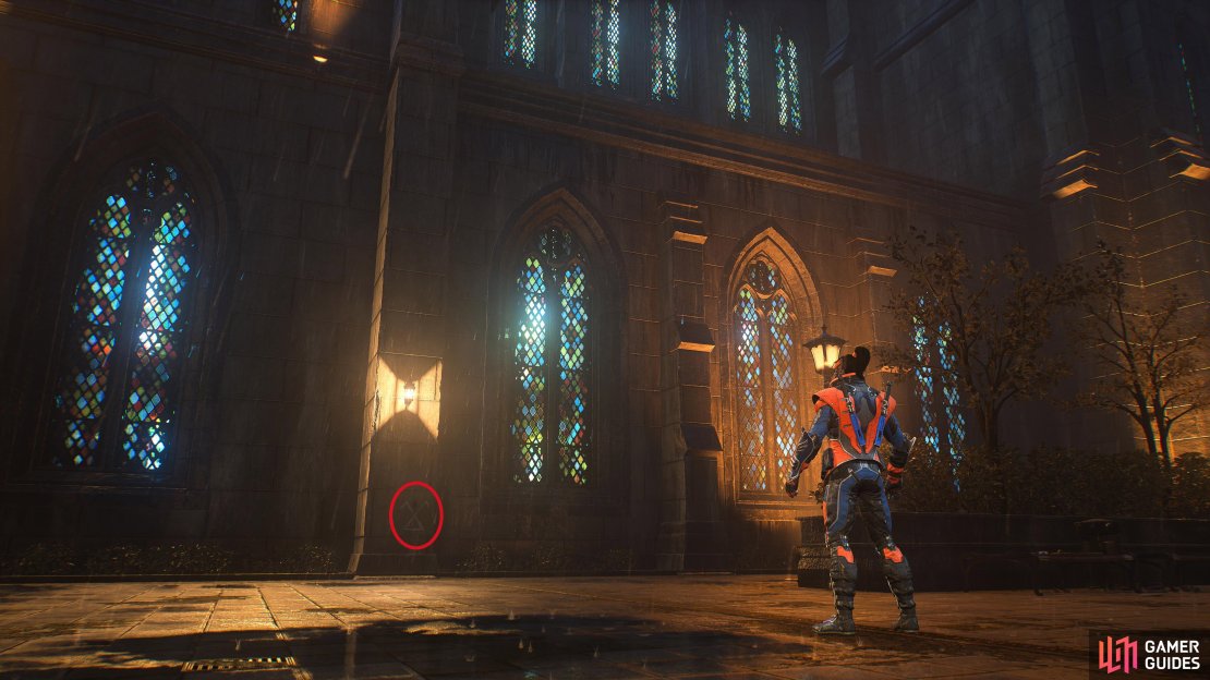 Under a spotlight on the eastern wall of the church between Rotterdam Street, and Storrow Street.