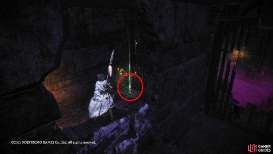 Head into the adjoining cell and jump through the hole in the wall.