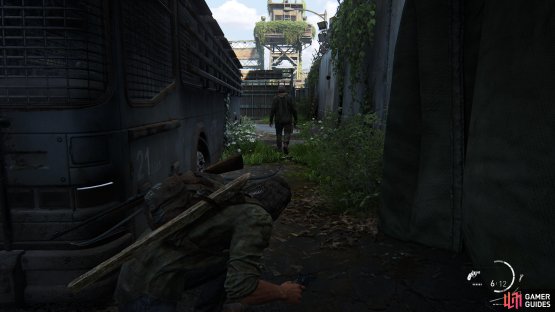 Wait for the guard to walk past the bus and take him out