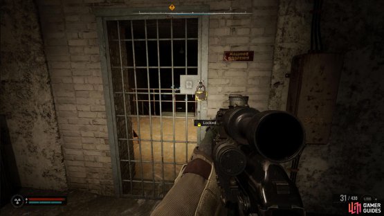 Shoot the padlock to gain access to the room.