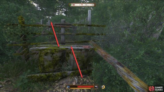 Go behind the ruins and use the barrels to jump over the fence.