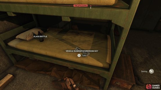 Follow the corridor and look at the bottom bunk to the right of the doorway to find the Key.