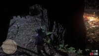 The head with the map piece is behind the tree