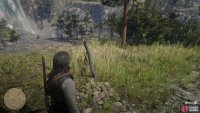 you’ll find the grave overlooking the river.