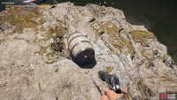 climb onto the rocks here to find the barrel on top.