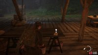 Go inside the first hut to find an Artefact on the table 