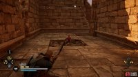 Shoot the fire pot on the blockade to destroy it.