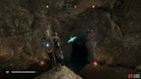 Enter the cave by the pond to begin the light beam puzzle.