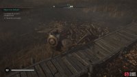 Examine the priest near the broken cart.