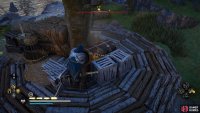 The chest is on top of a platform within the camp.