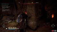 Move the rock barricade in the cave to reach the back.