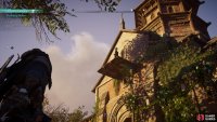 You’ll find Finnr on the wooden platform above the entrance to the church.