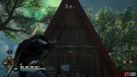 Shoot the wooden barricade at the back (eastern side) of the house to gain access.