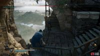 You’ll find Flann’s scout just beneath the bridge to the castle.
