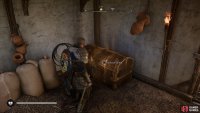 Use the key from the church to open the chest within the house.