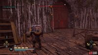 Use the lift to the left of the gate to get over the walls and reach the other side.