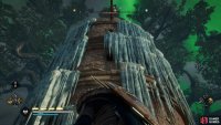 At the second set of wooden poles, look up to the southeast to find a route to the top of the tower.