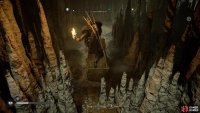 You’ll need to use the moveable rock objects to jump over the stalagmite barricades