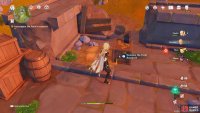 Climb up the ruined structure to find the Fatui Research laying on top of a crate.