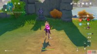 the west totem is sitting in front of a small stone wall and can be easily seen