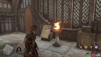 Cast a fire-based spell to light the brazier and reveal the page.