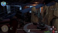 Find the telescope laying on the circular table in the center of the room.