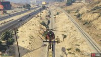 Finally, drop the gold onto the train and fly back to Trevor’s Airstrip. 