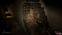 After defeating the zombies, look through the hole and shoot the canister to the left.