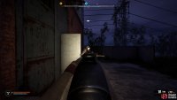 As you reach the main building, a zombie will come out of the door.